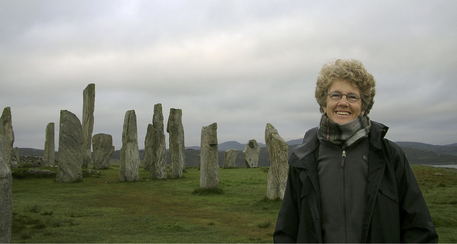 Margie standing in front of Callanish Stones